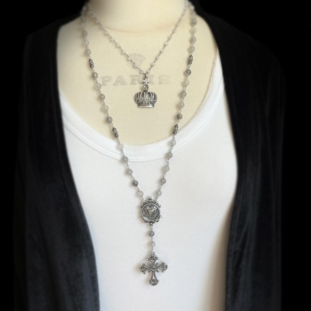 Styled photo showing layered necklaces with the mystic gray rosary necklace by Rock My Wings.