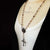 Full length view of copper crown rosary necklace