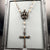 Showing dimensional crown detail on beaded rosary necklace