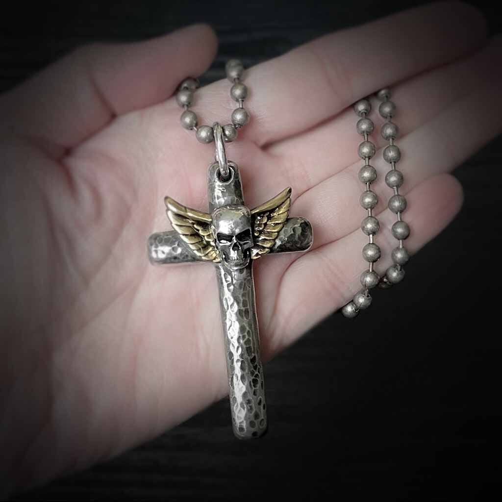 Bold and rebellious skull cross necklace for men or women. Rock in style.